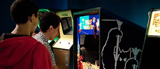 Student at an arcade game