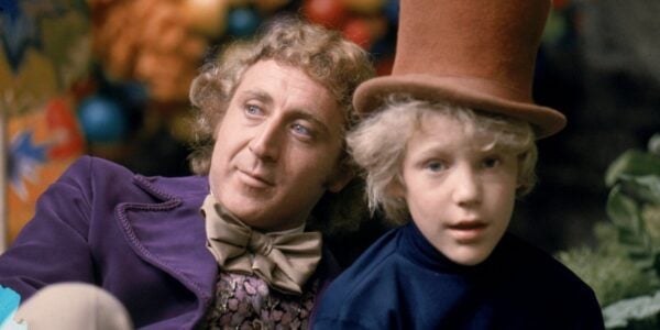 Willy Wonka on the left and Charlie Bucket on the right in a top hat