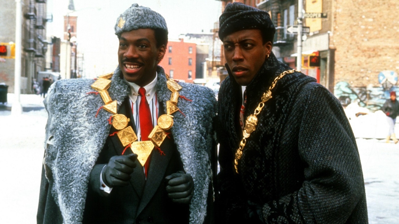 Two men wearing fur coats and medallions on a NYC street