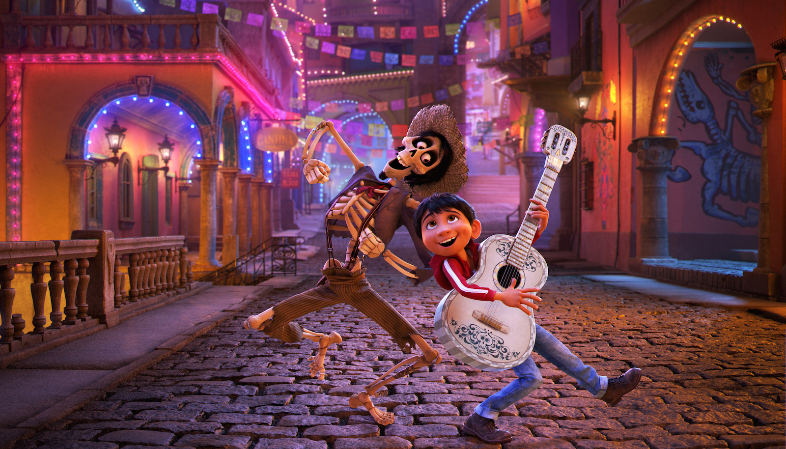 An animated image of a boy and a skeleton with a guitar singing a song on a street in Mexico