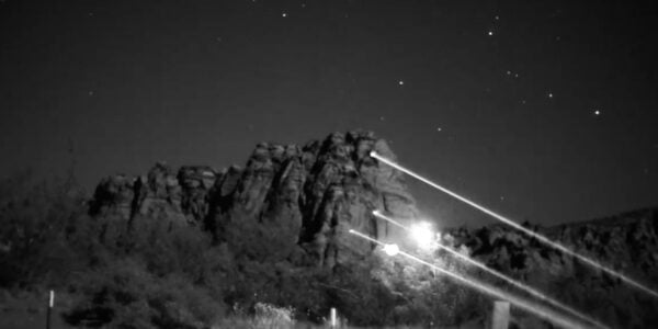 A mountainside emblazoned with infrared laser missiles