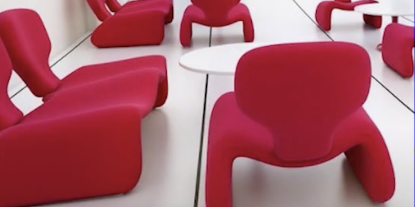 Futuristic red plush chairs on a white background from the set of 2001: A Space Odyssey