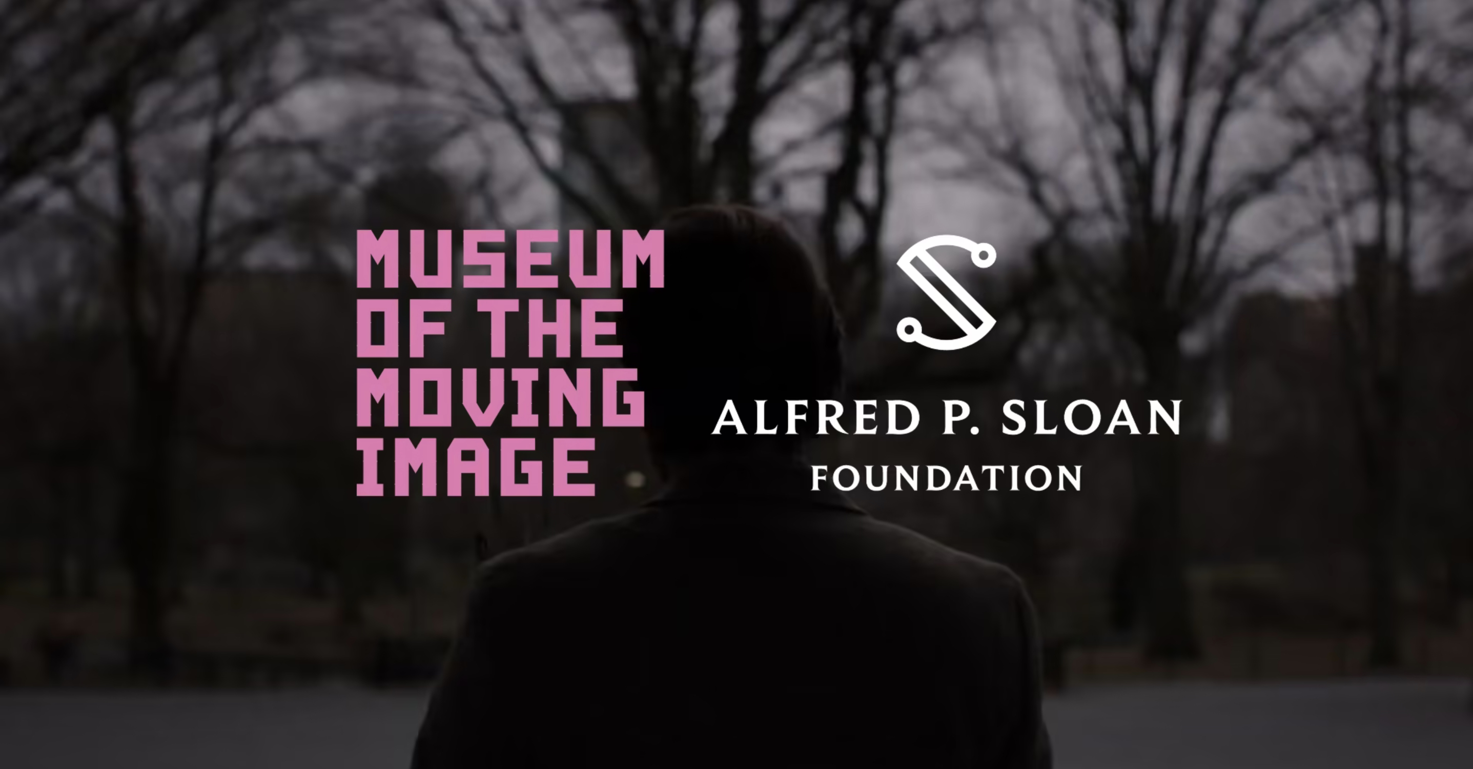 A person standing in the woods with a pink logo of Museum of the Moving Image and a logo for Alfred P. Sloan Foundation superimposed