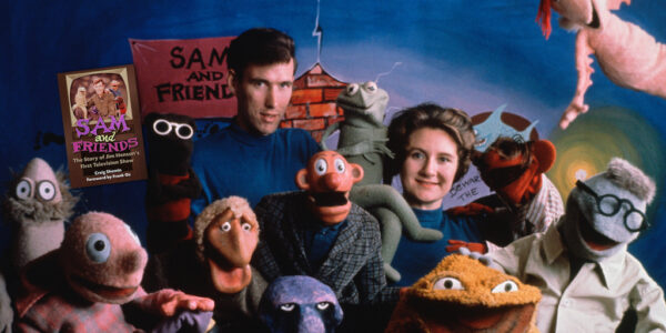 Jim and Jane Henson surrounded by muppets