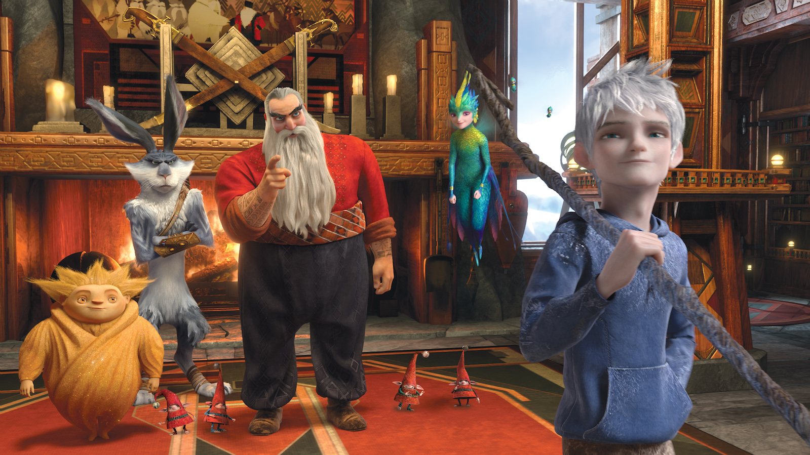 An animated image of fantastical creatures, including a man in a beard, a white-haired fairy, and a tall bunny rabbit looking at a boy holding a stick