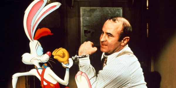 A man and an animated rabbit handcuffed together