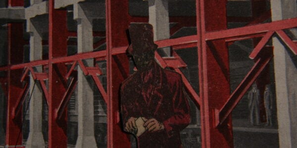 A cutout of a man in a red top hat and a dark face standing against red scaffolding