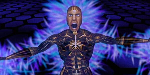 A CGI animated figure with its arms stretched out and wide gaping mouth looking at camera with angry expression